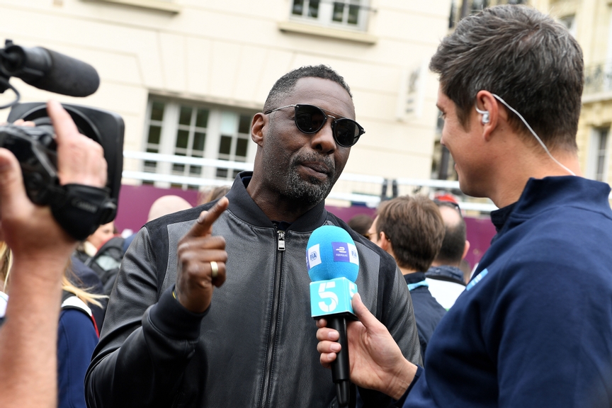 PARIS, FRANCE - APRIL 28: In this handout provided by FIA Formula E, Actor Idris Elba talking to TV Presenter Vernon Kaye.  during the Paris E-Prix in the Paris ePrix, Round 8 of the 2017/18 FIA ABB Formula E Series at Circuit des Invalides on April 28, 2018 in Paris, France. (Photo by Sam Bagnall - Handout/FIA Formula E via Getty Images)